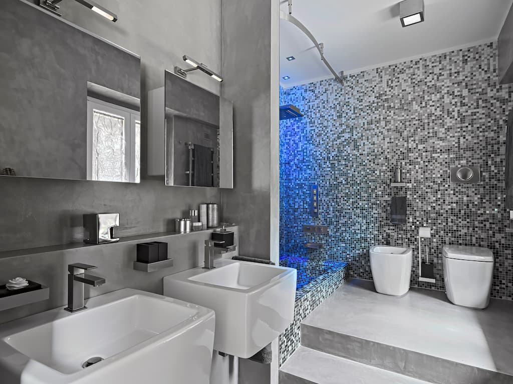 Make a bold statement in your guest bathroom using large mosaic tiles 