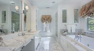 bathroom with marble countertops