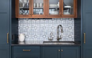 Navy cabinets with artistic backsplash