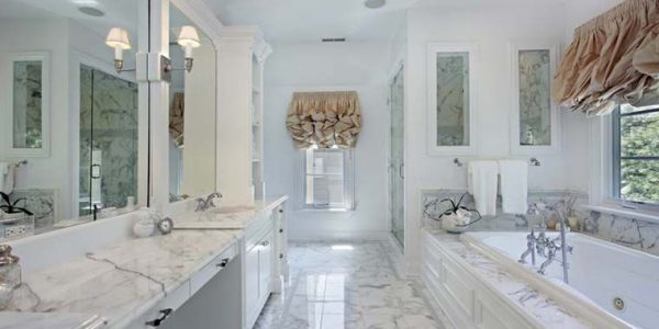 bathroom with marble countertops